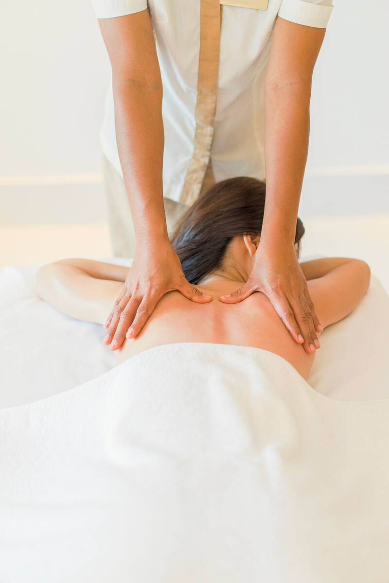 Young adult woman relaxing during massage